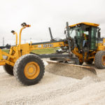 close up of motor grader working