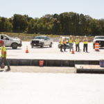 maagers overlook job on concrete pad