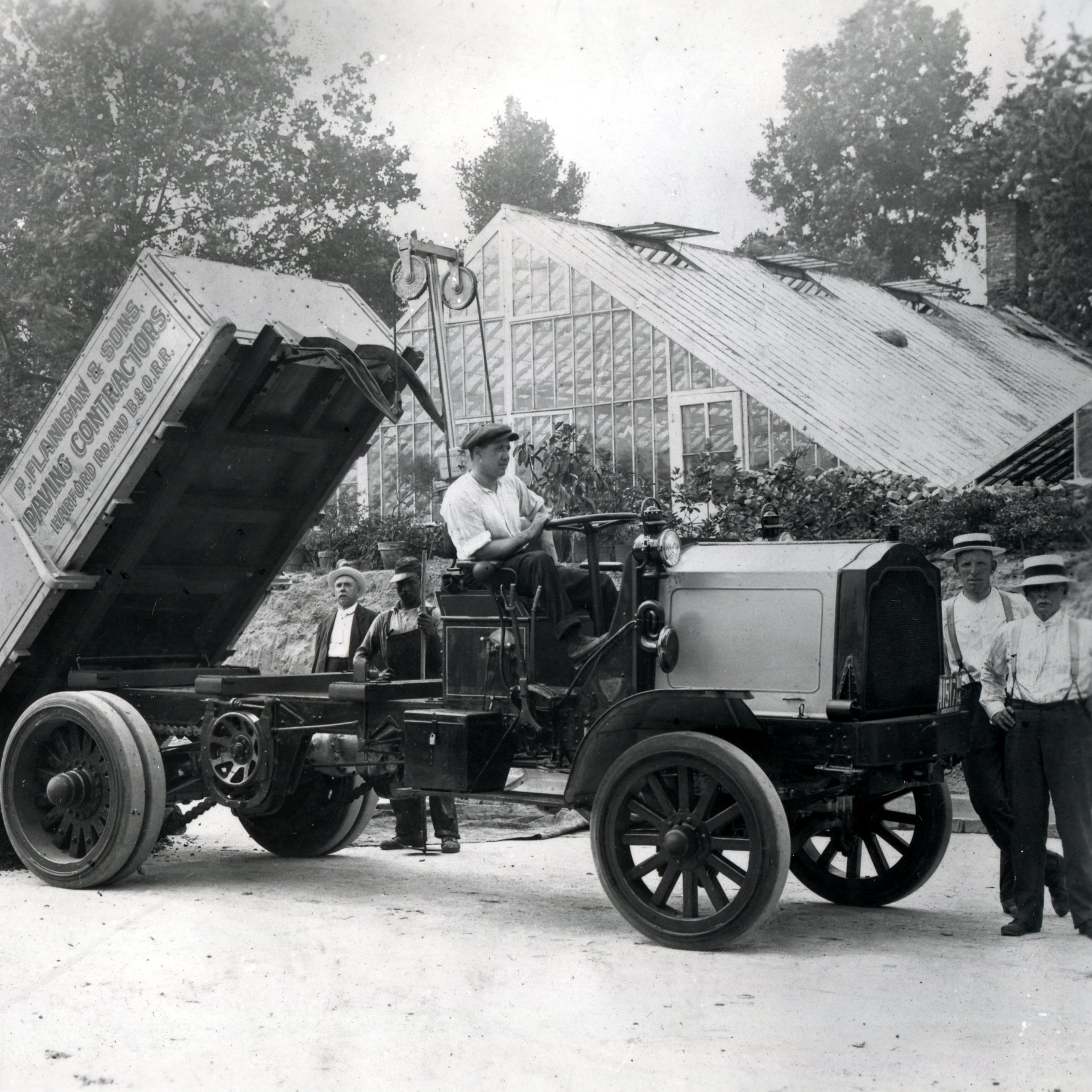 dump truck from 1912 in black and white