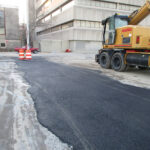 temporary asphalt patch over a trench in a parking lot at the Maryland MVA